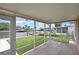 Enclosed lanai with tiled floor overlooking the canal and the boat dock beyond at 12637 2Nd Isle, Hudson, FL 34667