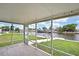 Screened in lanai featuring wood-look tile floor and waterfront views at 12637 2Nd Isle, Hudson, FL 34667
