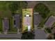 Aerial view highlighting property with a manicured lawn, patio, landscaping and privacy fence, next to neighboring houses at 13349 Niti Dr, Hudson, FL 34669