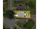 Aerial view showing property lines of a well-manicured lawn with a patio, landscaping and adjacent homes at 13349 Niti Dr, Hudson, FL 34669