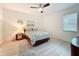 Comfortable bedroom showcases stylish decor, wood-look flooring, and ample natural light at 13349 Niti Dr, Hudson, FL 34669