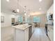 Bright and airy kitchen features an island, stainless steel appliances, and an open layout at 13349 Niti Dr, Hudson, FL 34669