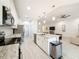 Modern kitchen featuring a large island, stainless steel appliances, and granite countertops at 13349 Niti Dr, Hudson, FL 34669