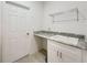 Laundry room with sink, countertop and storage, featuring neutral color palette at 13349 Niti Dr, Hudson, FL 34669