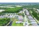 Aerial view showcasing a well-maintained residential area with neatly aligned homes and lush landscaping at 14011 Shoal Dr, Hudson, FL 34667