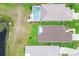 Aerial view of houses with swimming pools, ponds, and landscaped yards; perfect for relaxation at 14011 Shoal Dr, Hudson, FL 34667