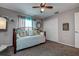Bedroom with a daybed, a ceiling fan, a closet, and soft, natural light at 14011 Shoal Dr, Hudson, FL 34667