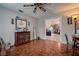 Bedroom with parquet floors, neutral walls, ceiling fan, and built in storage, offering a cozy retreat at 14011 Shoal Dr, Hudson, FL 34667