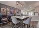Dining room next to a modern kitchen, featuring stylish lighting and decor, perfect for entertaining guests at 14011 Shoal Dr, Hudson, FL 34667