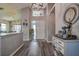 Inviting foyer featuring hardwood floors, elegant decor, and a well-lit entrance, setting a welcoming tone at 14011 Shoal Dr, Hudson, FL 34667