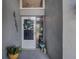 A welcoming front door area featuring stylish decorations and a delightful garden gnome at 14011 Shoal Dr, Hudson, FL 34667