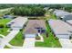 Beautiful single-Gathering home with a two-car garage, walkway, and well-maintained lawn near a pond at 14011 Shoal Dr, Hudson, FL 34667