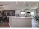 Bright kitchen boasts a center island, patterned backsplash, white cabinets, and ample counter space at 14011 Shoal Dr, Hudson, FL 34667