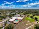 A sprawling community center with a pool, tennis courts, and golf course amidst a lush landscape at 16037 Brookridge Blvd, Brooksville, FL 34613