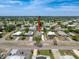 An elevated view of the property shows the home nestled in a vibrant, green community at 16037 Brookridge Blvd, Brooksville, FL 34613