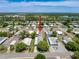 An aerial view of a lovely home and its surrounding neighborhood, boasting well-maintained streets at 16037 Brookridge Blvd, Brooksville, FL 34613