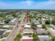 Aerial view of a cozy residence in a peaceful neighborhood, surrounded by well-kept lawns and tree-lined streets at 16037 Brookridge Blvd, Brooksville, FL 34613