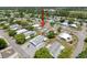 Aerial view of a charming property surrounded by lush trees in a peaceful neighborhood at 16037 Brookridge Blvd, Brooksville, FL 34613
