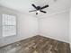 Cozy bedroom with ample natural light from the window and ceiling fan at 16037 Brookridge Blvd, Brooksville, FL 34613