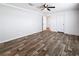 This bedroom has neutral paint, wood-look flooring, ensuite bathroom, and two closets at 16037 Brookridge Blvd, Brooksville, FL 34613
