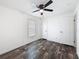 This bedroom boasts wood-look floors, and a ceiling fan at 16037 Brookridge Blvd, Brooksville, FL 34613