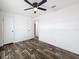Bedroom features wood-look flooring, a ceiling fan, and closet at 16037 Brookridge Blvd, Brooksville, FL 34613