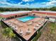 A dazzling community pool with lounge chairs and tables offers a relaxing outdoor gathering space at 16037 Brookridge Blvd, Brooksville, FL 34613