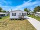 Charming single-story home featuring a covered carport and a well-maintained lawn at 16037 Brookridge Blvd, Brooksville, FL 34613