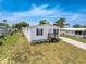 Charming single-story home featuring a covered carport and a well-maintained lawn at 16037 Brookridge Blvd, Brooksville, FL 34613