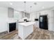 Bright kitchen featuring grey cabinets, a center island, and stainless steel appliances at 16037 Brookridge Blvd, Brooksville, FL 34613