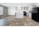 Modern kitchen featuring grey cabinets, a center island, and stainless steel appliances at 16037 Brookridge Blvd, Brooksville, FL 34613
