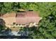An aerial perspective showcases a townhome community with tree-lined streets and green spaces at 2139 Sea Pines Ct, Spring Hill, FL 34606