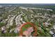 Aerial view of a neighborhood showcasing mature trees, lush greenery, and well-maintained homes at 2139 Sea Pines Ct, Spring Hill, FL 34606