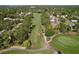 Aerial view of a well-manicured golf course with lush greenery and mature trees at 2139 Sea Pines Ct, Spring Hill, FL 34606