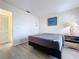 Bedroom featuring neutral colors and wood-look flooring at 2139 Sea Pines Ct, Spring Hill, FL 34606