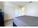 This bedroom features laminate flooring, a double door closet, and bright white walls at 2139 Sea Pines Ct, Spring Hill, FL 34606