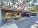 Spacious covered parking area with ample space for vehicles and storage at 2139 Sea Pines Ct, Spring Hill, FL 34606