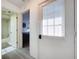 Hallway view with a view into the bedroom and bathroom at 2139 Sea Pines Ct, Spring Hill, FL 34606