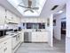 Bright kitchen with stainless steel appliances, light wood cabinets, and modern flooring at 2139 Sea Pines Ct, Spring Hill, FL 34606