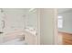 Cozy bathroom featuring a tub-shower combo, single vanity, and ample natural light from the window, next to the bedroom at 2348 Rolling View Dr, Spring Hill, FL 34606