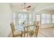 Bright breakfast nook with large windows and a ceiling fan at 2348 Rolling View Dr, Spring Hill, FL 34606
