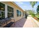 The exterior features a patio, palm trees, and a bench at 2348 Rolling View Dr, Spring Hill, FL 34606