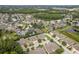 Community aerial view showcases tree-lined streets, ponds, and well-maintained landscaping at 2526 Brinley Dr, Trinity, FL 34655