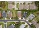 Aerial view showcases the neighborhood's layout and the home's proximity to community amenities, manicured lawns, and private pools at 2526 Brinley Dr, Trinity, FL 34655