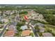 An aerial view shows this home is nestled in a serene community with lush landscaping and nearby water features at 2526 Brinley Dr, Trinity, FL 34655