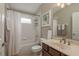 Well lit bathroom featuring updated vanity, shower-tub combo, and modern fixtures at 2526 Brinley Dr, Trinity, FL 34655