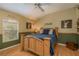 Bedroom with a light wood frame bed, natural light and rustic decor at 2526 Brinley Dr, Trinity, FL 34655