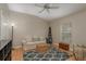 Bonus room with hardwood flooring, comfortable seating, a ceiling fan and a decor ladder at 2526 Brinley Dr, Trinity, FL 34655