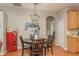 Charming dining area features decorative lighting, vintage Coca-Cola machine at 2526 Brinley Dr, Trinity, FL 34655