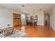 A dining room featuring hardwood floors, a large mirror, and elegant light fixtures at 2526 Brinley Dr, Trinity, FL 34655